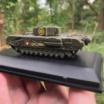 Photo of a tiny model tank on a plastic plinth.